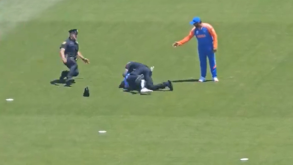 T20 World Cup 2024 Fan invades pitch to meet Rohit Sharma during IND vs BAN warm-up game T20 World Cup 2024 Fan invades pitch to meet Rohit Sharma during IND vs BAN warm-up game