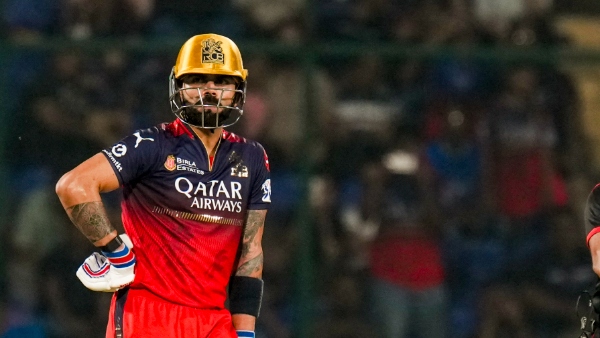 Virat Kohli touches coach Rajkumar Sharma s feet After RCB beat DC in IPL 2025 Virat Kohli touches coach Rajkumar Sharma s feet After RCB beat DC in IPL 2025